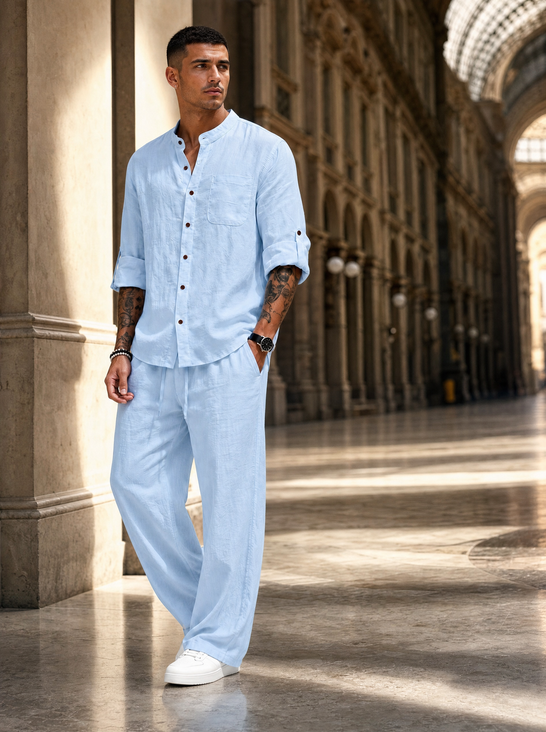 Editoriale uomo con completo azzurro in lino e cotone