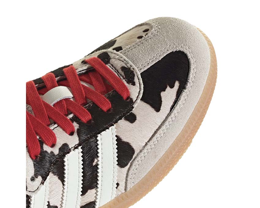 Scarpe da ginnastica basse in pelle con motivo mucca per donna