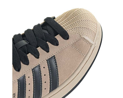 Scarpe da ginnastica in pelle color cachi pietra con design iconico a conchiglia